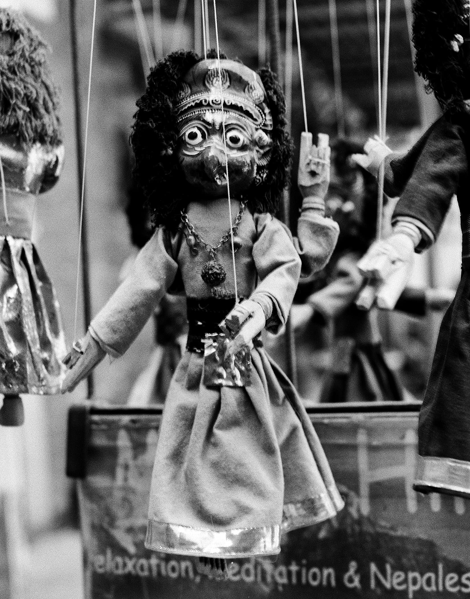 Traditional Nepali marionette puppet hanging on strings
