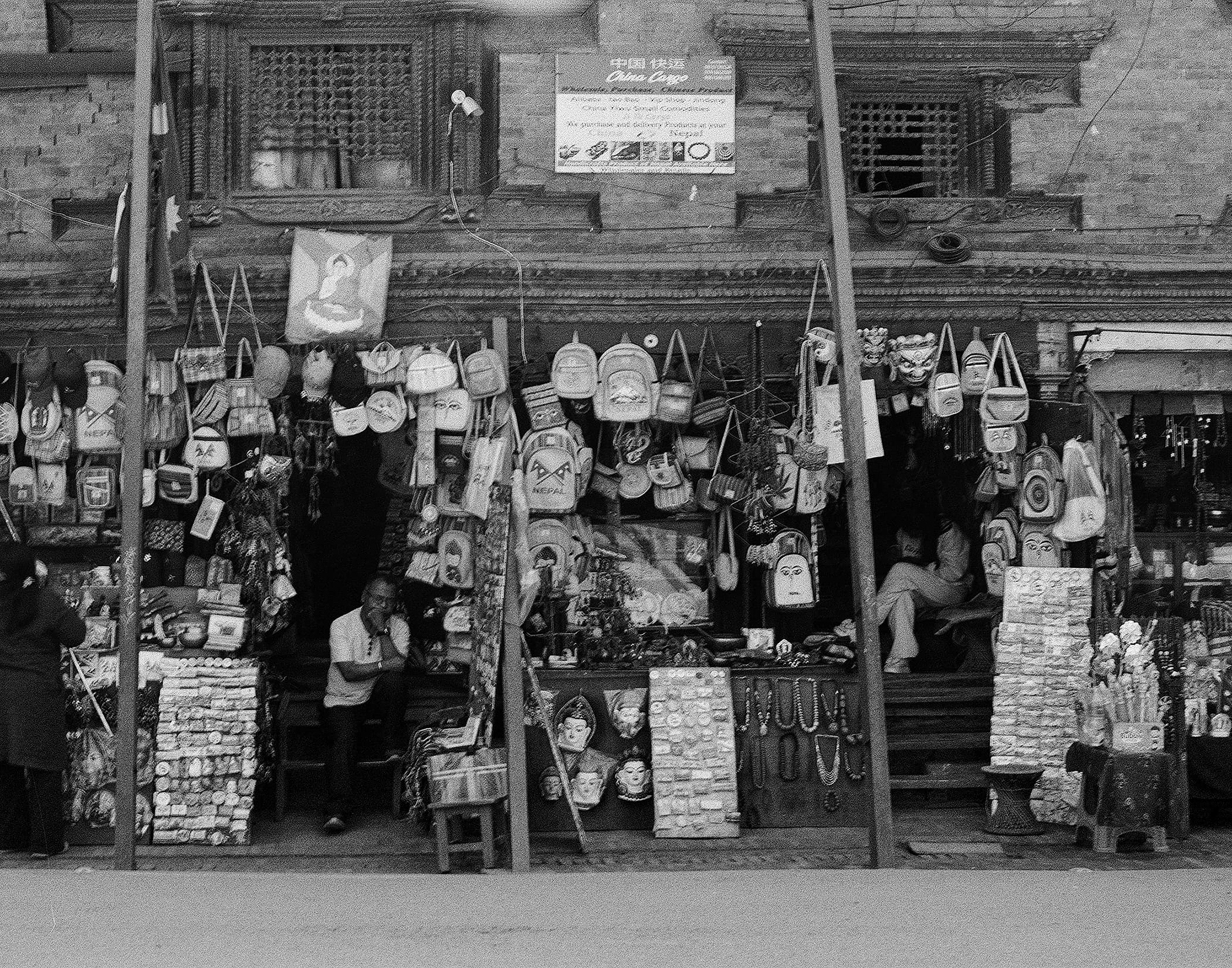 Souvenir shopfront hung with bags, masks and jewelry