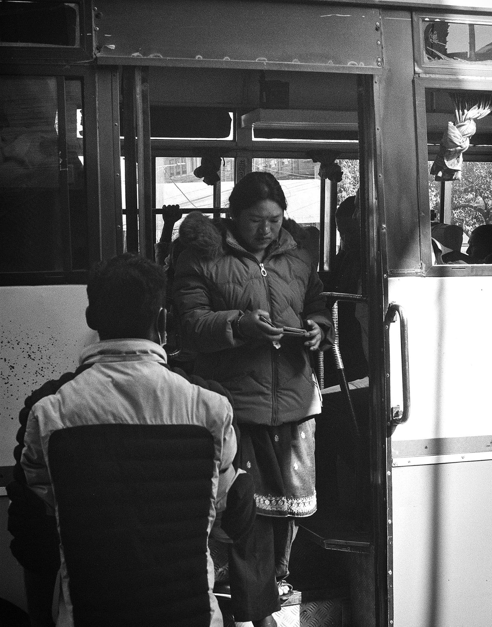 Passengers boarding a crowded city bus