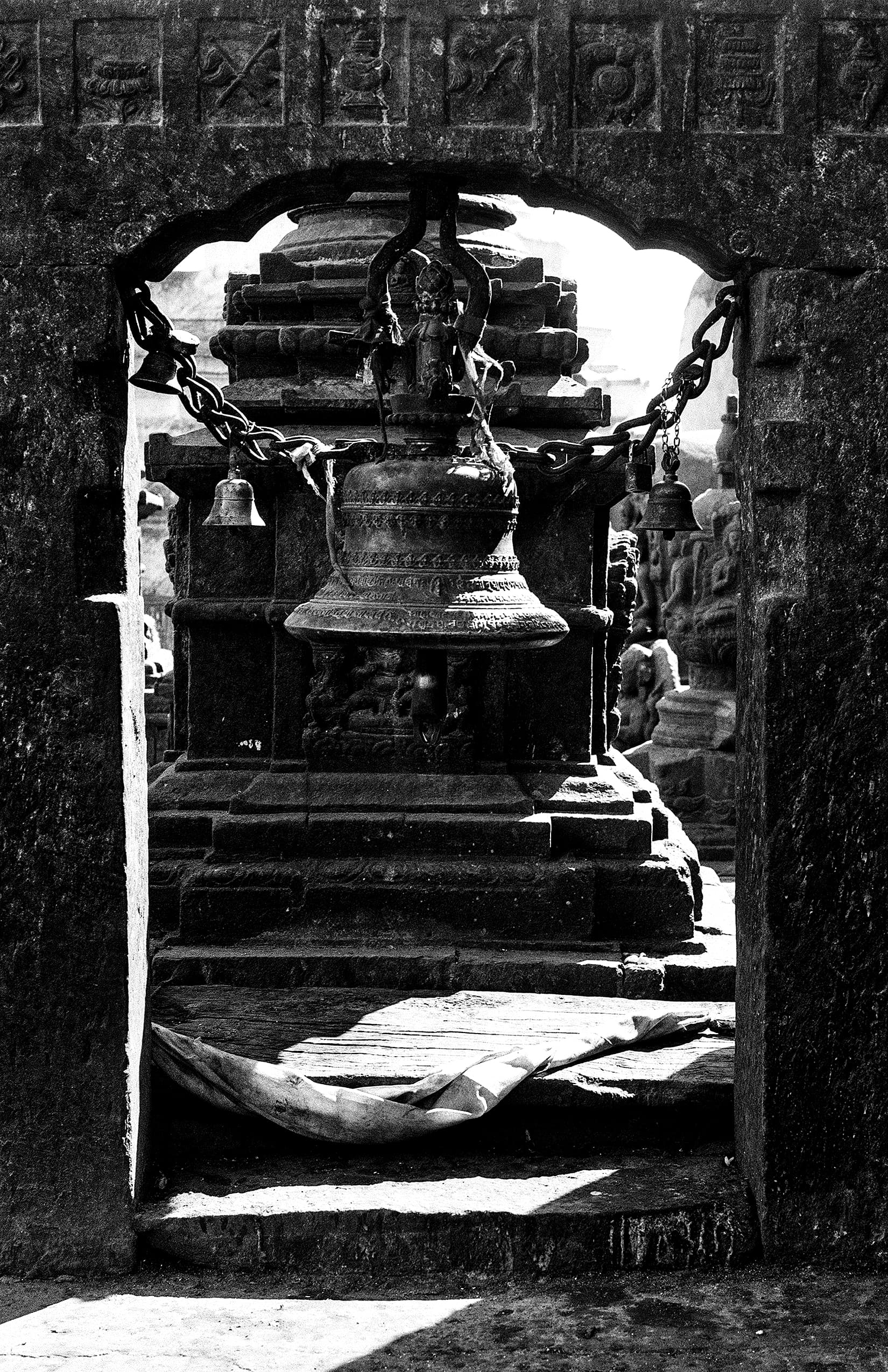 Carved shrine pavilion reflected in a still pond